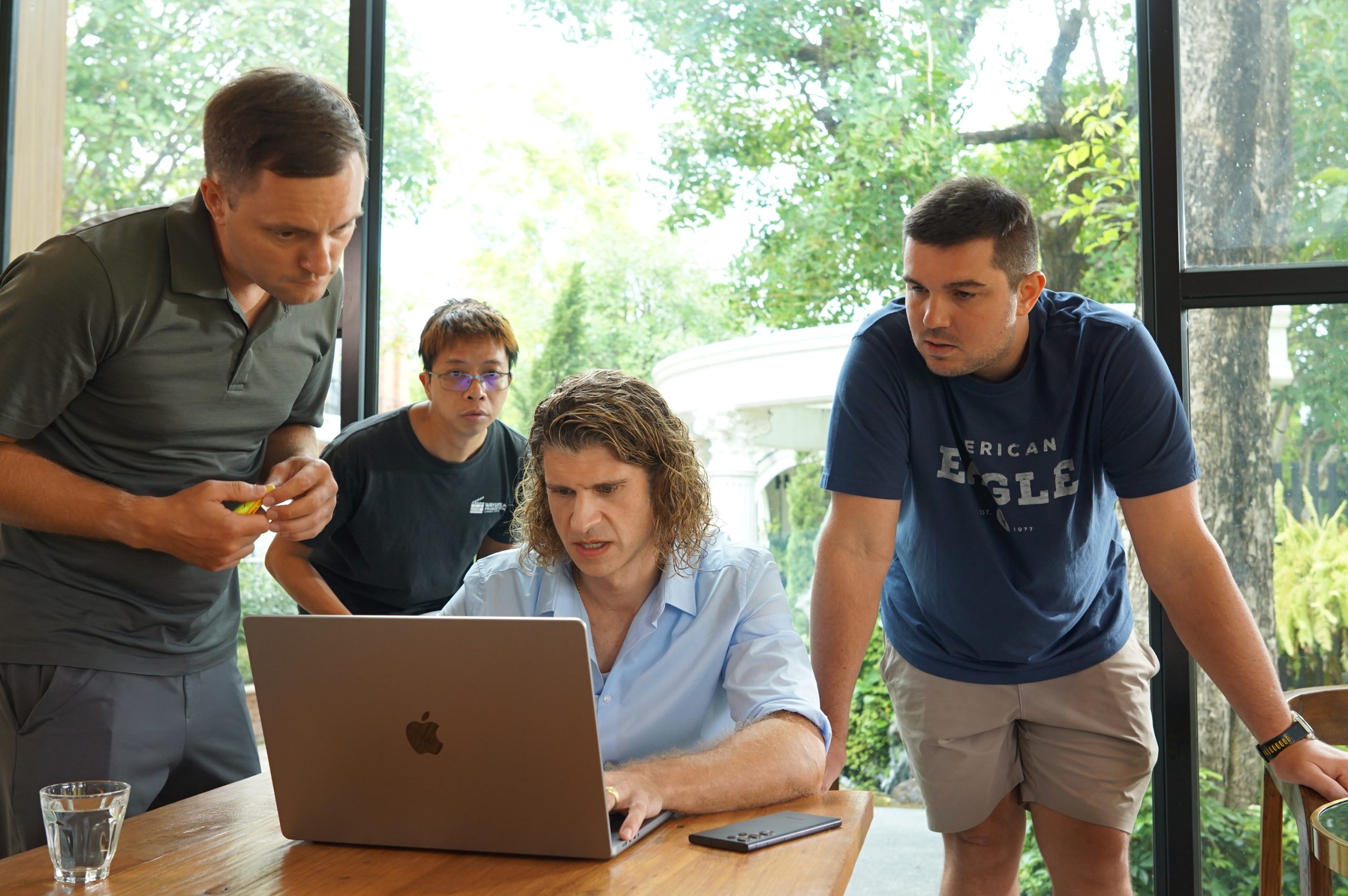 Tailored Social team planning a campaign together around a laptop